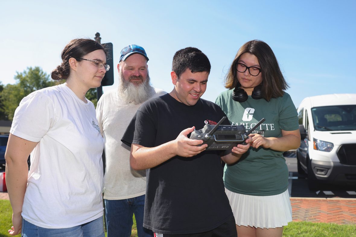 Group of students learning about drones