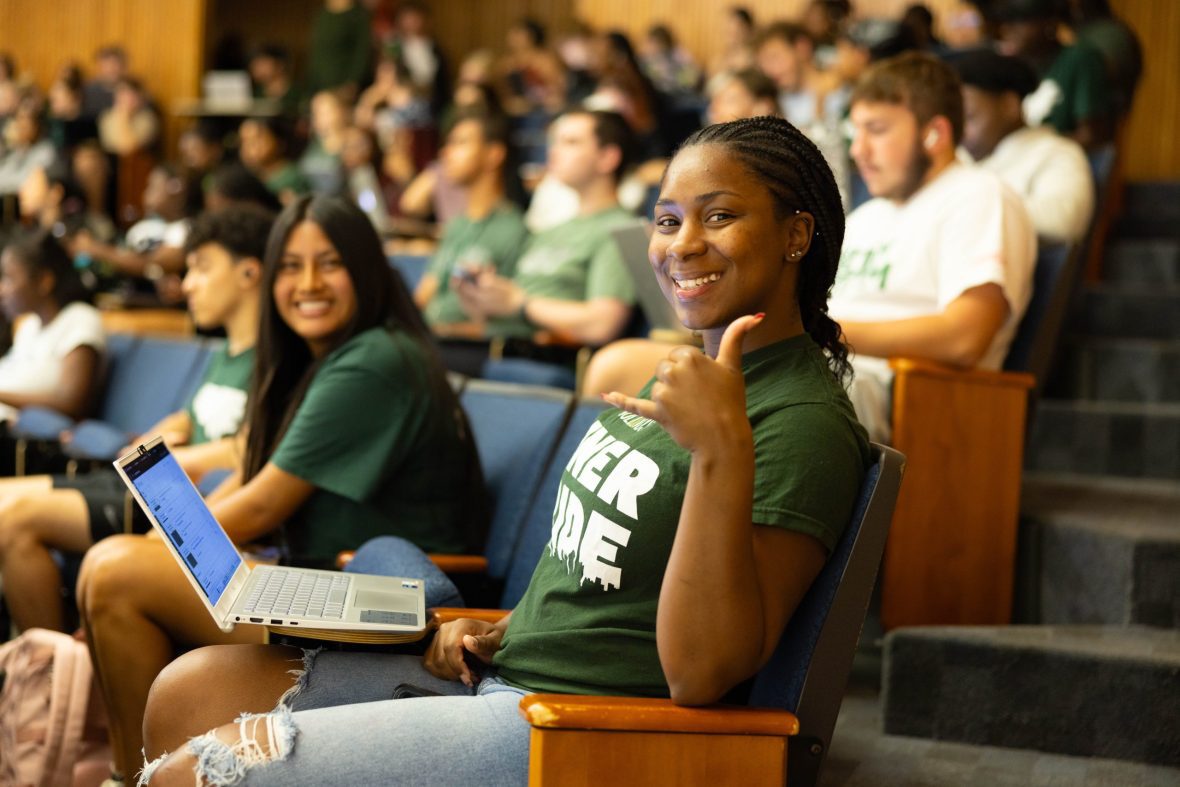 Student giving thumbs up in class