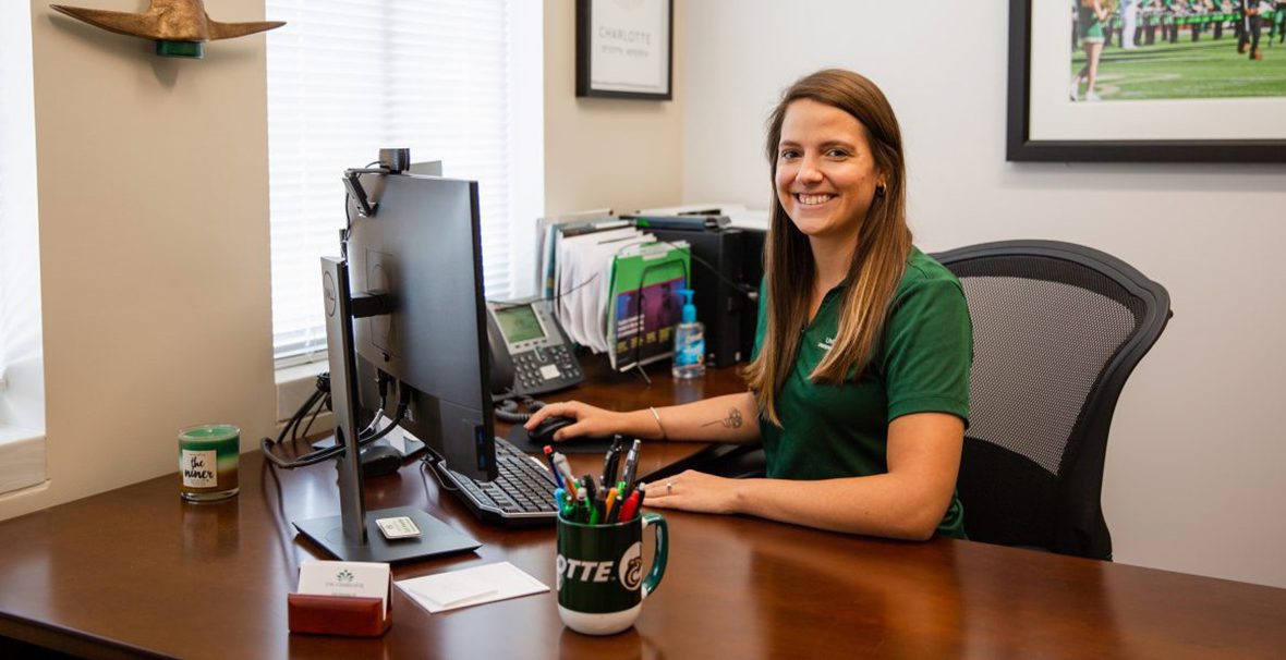 Advisor sitting at a desk with a computer