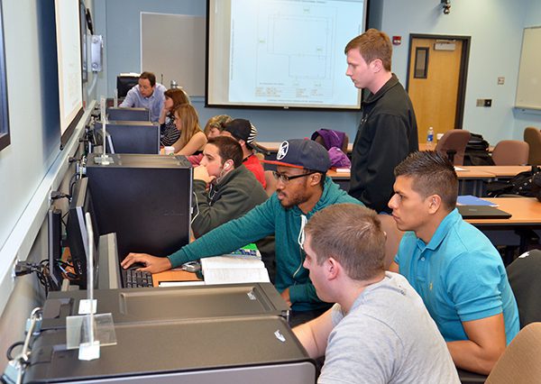 Students in the SEEM department working on a project