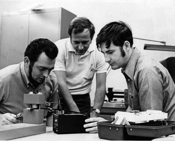 Ron Priebe working in a lab with students