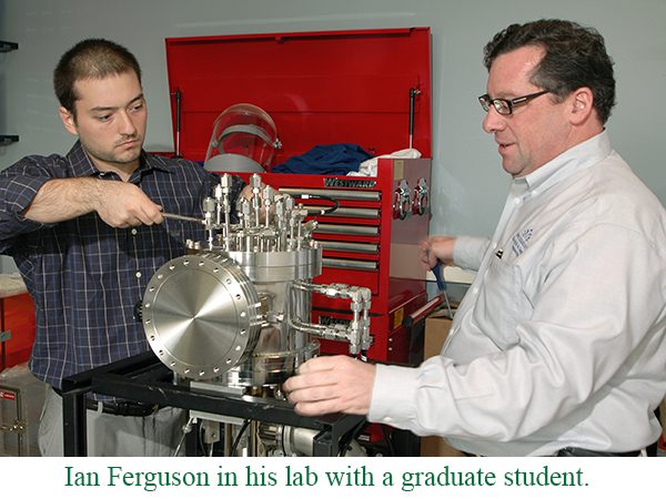 Ian Ferguson in his lab with a graduate student