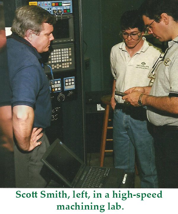 Scott Smith, left, in a high speed machine lab