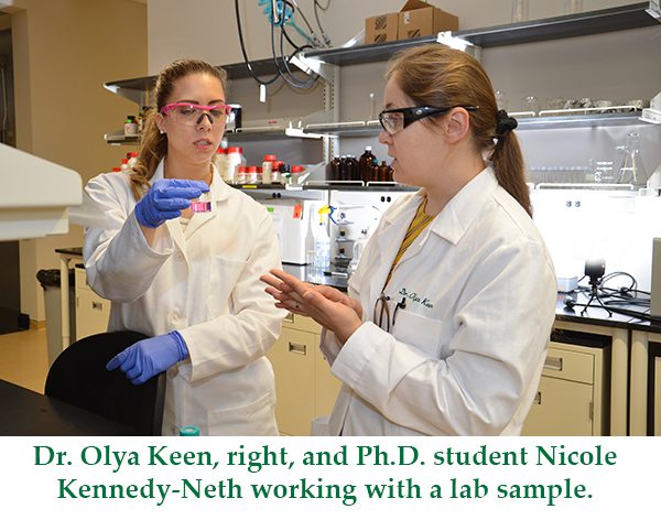 Dr. Olya Keen and Ph.D student Nicole Kennedy Neth working with a lab sample