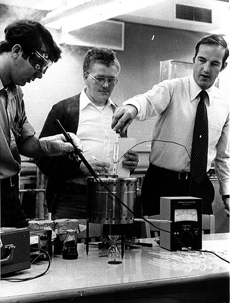 Ron Priebe working in a lab with students