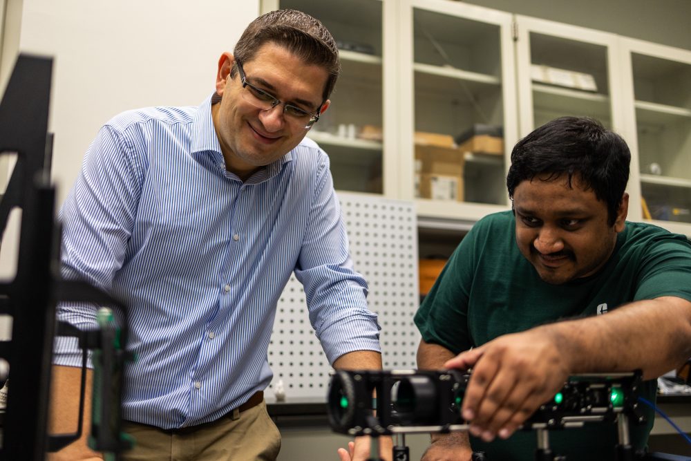 Professor working with a student in a lab