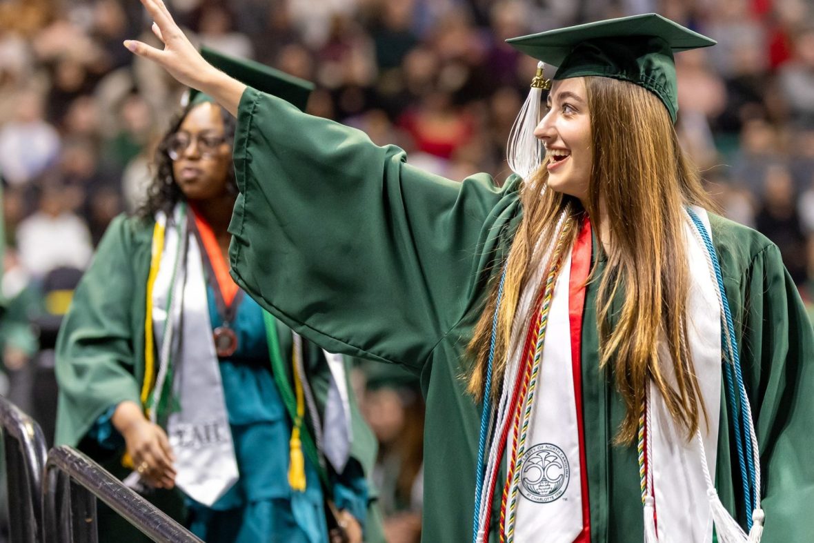 Female student walking during graduation ceremony