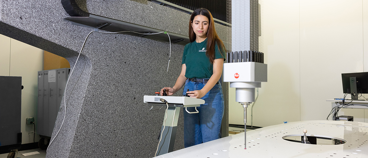 Student using precision metrology equipment