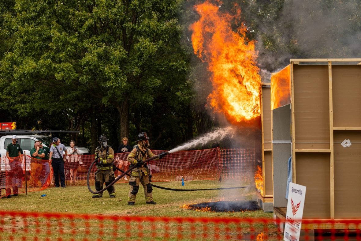 Firefighters put out fire during a mock dorm burn