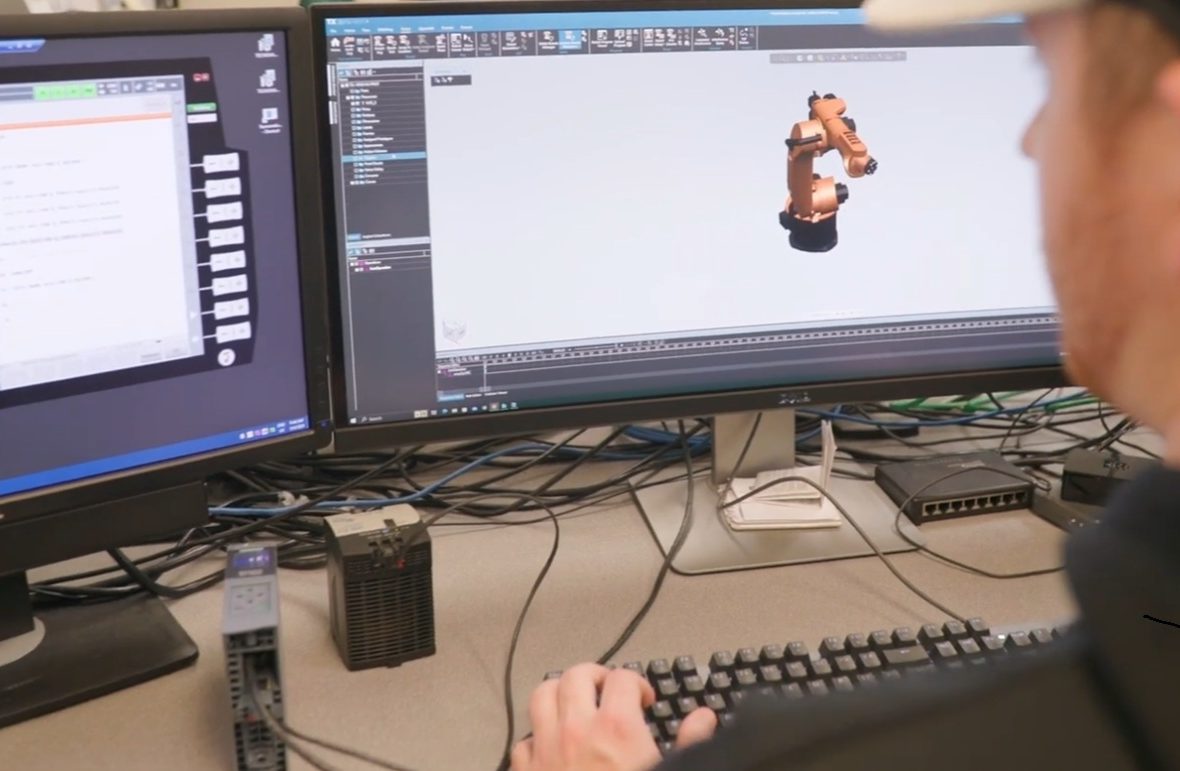 Student looks at two computer screens
