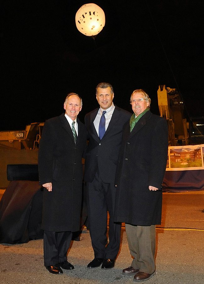Phil Dubois, Dhiaa Jamil and Bob Johnson standing at the EPIC construction site at night